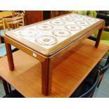 A TEAK FRAMED TILE TOP COFFEE TABLE the rectangular top 112cm x 51cm inset with ten tiles, 40cm high