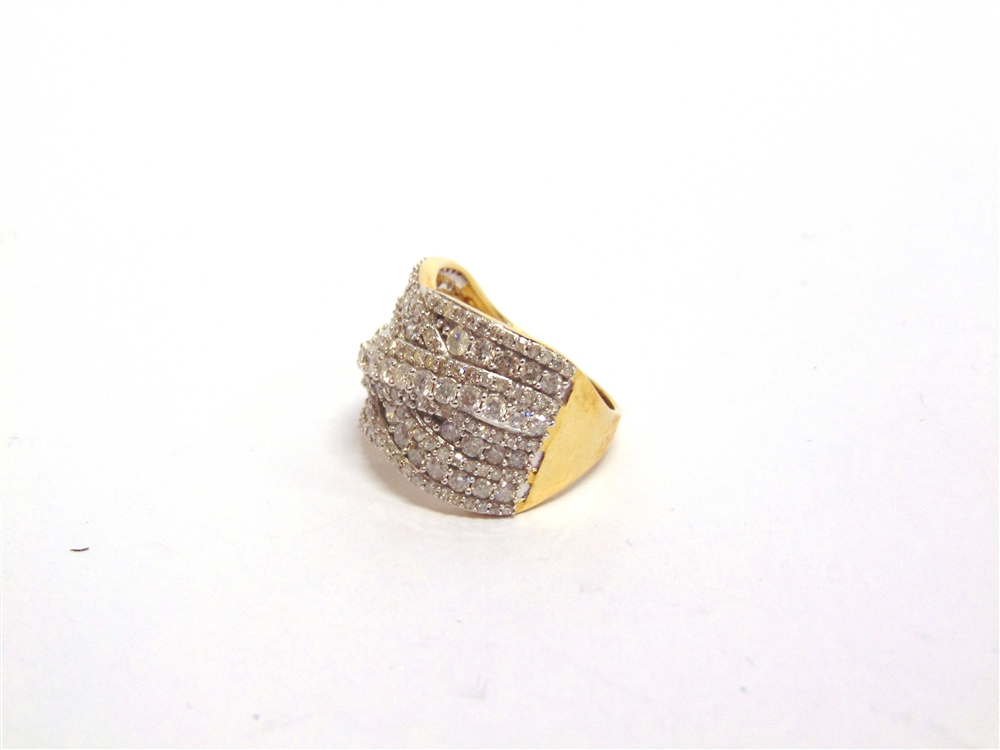 A 9 CARAT GOLD DIAMOND DRESS RING of crossover design with lines of brilliant and single cuts, the - Image 2 of 2