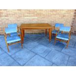 A 1960S TABLE AND CHAIRS the table with rectangular top 139cm x 78cm, on tapering supports 74cm high