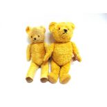 TWO ENGLISH GOLD PLUSH TEDDY BEARS circa 1950s-60s, with orange plastic eyes and black vertically