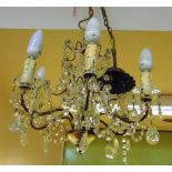 A GILT METAL AND GLASS CEILING LIGHT FITTING fitted with six lights, 43cm high