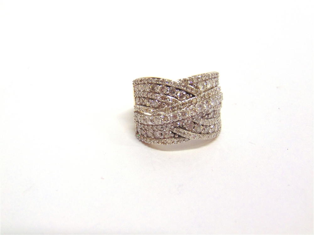 A 9 CARAT GOLD DIAMOND DRESS RING of crossover design with lines of brilliant and single cuts, the