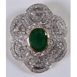 AN EMERALD AND DIAMOND PANEL BROOCH PENDANT unmarked, the oval cut, approximately 10.5 by 8.2 by 5mm