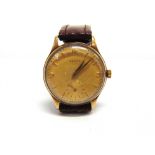 ZENITH a gentleman's 9 carat gold mechanical wristwatch, the round yellow dial with gilt dagger