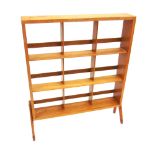A LIGHT OAK THREE-TIER OPEN BOOKCASE with trade label to back 'THE PENGUIN BOOKSHELF BEAVER & TAPLEY