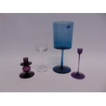 RONALD STENNETT-WILLSON FOR WEDGWOOD: an aubergine glass candlestick 11cm high, with original