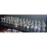 FORTY-THREE ROYAL HAMPSHIRE & OTHER CAST METAL SOLDIER FIGURINES each set to a plinth base.