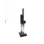 A THREE SECTION CHROME STEEL VASE on ebonised square base, 49cm high overall