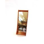 A 1960S TEAK FRAMED MIRROR WITH INTEGRAL SHELF 40cm wide 106cm high; another teak framed wall mirror