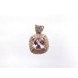 A 9 CARAT GOLD KUNZITE AND DIAMOND PENDANT the cushion shaped stone, 7.8 by 7.9 by 5.6mm deep,