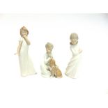 THREE LLADRO FIGURES OF YOUNG CHILDREN: a boy with his dog, a young girl yawning and another girl