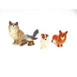 A GROUP OF FOUR BESWICK ANIMALS: a seated cat model 1867, 20cm high (ear re-glued), a cuckoo model