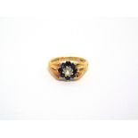 A 9 CARAT GOLD DIAMOND AND SAPPHIRE CLUSTER RING the old brilliant cut enclosed by eight