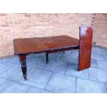 A VICTORIAN MAHOGANY RECTANGLAR EXTENDING DINING TABLE with two leaves, the four turned supports
