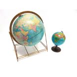 A 1960S 'CRAMS IMPERIAL 12 INCH WORLD GLOBE' with metal frame, together with two further smaller