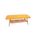 A LIGHT ERCOL RECTANGULAR COFFEE TABLE with magazine rack undertier