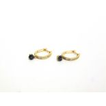 A PAIR OF 9 CARAT GOLD DIAMOND AND BLUE DIAMOND HOOP EARRINGS channel set with baguettes and a seven