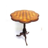 A VICTORIAN WALNUT OCCASIONAL TABLE with chess board top, 51cm diameter 72cm high