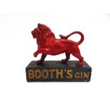 A BOOTH'S GIN PAINTED PLASTER ADVERTISING FIGURE in the form of a lion set to a plinth base, 27cm