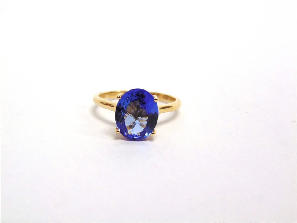 A 9 CARAT GOLD TANZANITE SINGLE STONE RING the oval cut 10.4 by 8.8 by 4.2mm deep, finger size Q,