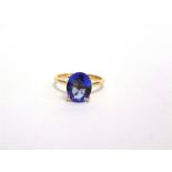 A 9 CARAT GOLD TANZANITE SINGLE STONE RING the oval cut 10.4 by 8.8 by 4.2mm deep, finger size Q,