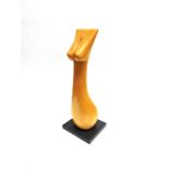 A LARGE CARVED FRUITWOOD SCULPTURE modelled as a stylised nude female form, on square marble base,