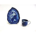 AN 18TH CENTURY ENGLISH PORCELAIN TEA CUP underglaze blue painted Chinoiserie decoration 6cm high;