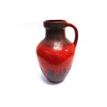 A LARGE WEST GERMAN 'FAT LAVA' FLOOR VASE with single handle and red drip glaze, 47cm high