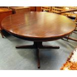 A DANISH EXTENDING DINING TABLE AND SET OF SIX CHAIRS the table 125cm diameter on cruciform with