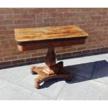 A VICTORIAN ROSEWOOD 'D' SHAPED FOLD OVER CARD TABLE raised on a shaped pedestal with incurving