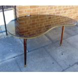 A 1950S THREE LEGGED OCCASIONAL TABLE in the form of an artists palette, 114cm wide 65cm deep 60cm