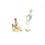 TWO LLADRO GROUPS: a young girl feeding a lamb on her lap, and a girl standing holding a lamb, the