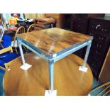 A 1960S ROSEWOOD TOP COFFEE TABLE with aluminium framed base, 61cm square 45cm high