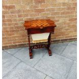 A VICTORIAN FIGURED MAHOGANY GAMES/WORK TABLE the chess board inlaid top above fitted drawer and