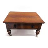 A ROSEWOOD OCCASIONAL TABLE fitted with single drawer on turned supports with brass casters (