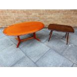 AN ERCOL COFFEE TABLE the shaped rectangular top 45cm x 71cm; together with another larger