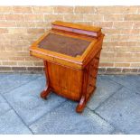 A VICTORIAN WALNUT DAVENPORT with stationery rack over, the lid with inset leather top, and fitted
