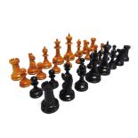 A STAUNTON PATTERN BOXWOOD & EBONY CHESS SET unsigned, the kings 86mm high, contained in a plain
