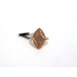 A 9 CARAT GOLD COGNAC DIAMOND AND DIAMOND MARQUISE CLUSTER RING the fifty eight brilliant cuts