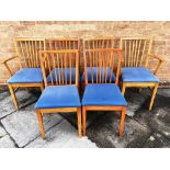 A SET OF SIX BEECH FRAMED STICKBACK DINING CHAIRS including a pair of carvers