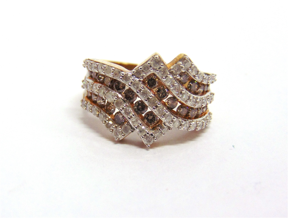 A 9 CARAT GOLD DIAMOND AND COGNAC DIAMOND DRESS RING set with crossing lines of fifty seven