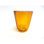 AN AMBER GLASS VASE with facetted sides, probably Czech, 16cm high