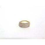 A 9 CARAT GOLD DIAMOND HALF HOOP RING the three line centre of 45 brilliant cuts totalling