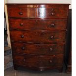 A TALL VICTORIAN MAHOGANY BOW FRONT CHEST OF DRAWERS the two short and four long graduated drawers