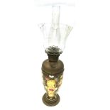 A LATE VICTORIAN OIL LAMP with frilled glass shade, the brass reservoir supported on a baluster
