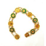 A CHINESE JADE BRACELET stamped 'Y.C.' and '18K', the circular panels alternating with a jade circle