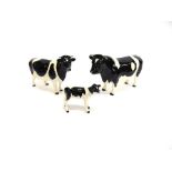 A BESWICK FAMILY GROUP OF FREISIAN CATTLE comprising bull 'CH. CODDINGTON HILT BAR'; cow 'CH.