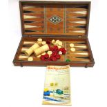 AN INDIAN IVORY-INLAID FOLDING BACKGAMMON / CHESS BOARD late 19th century, together with a set of