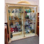 A LARGE ITALIANATE DISPLAY CABINET with gilt decorated frieze and pilasters, two pairs of heavy