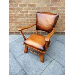 A CONTINENTAL LEATHER UPHOLSTERED ARMCHAIR stamped 'L.E. MODELE DEPOSE', 65cm wide 73cm deep 83cm